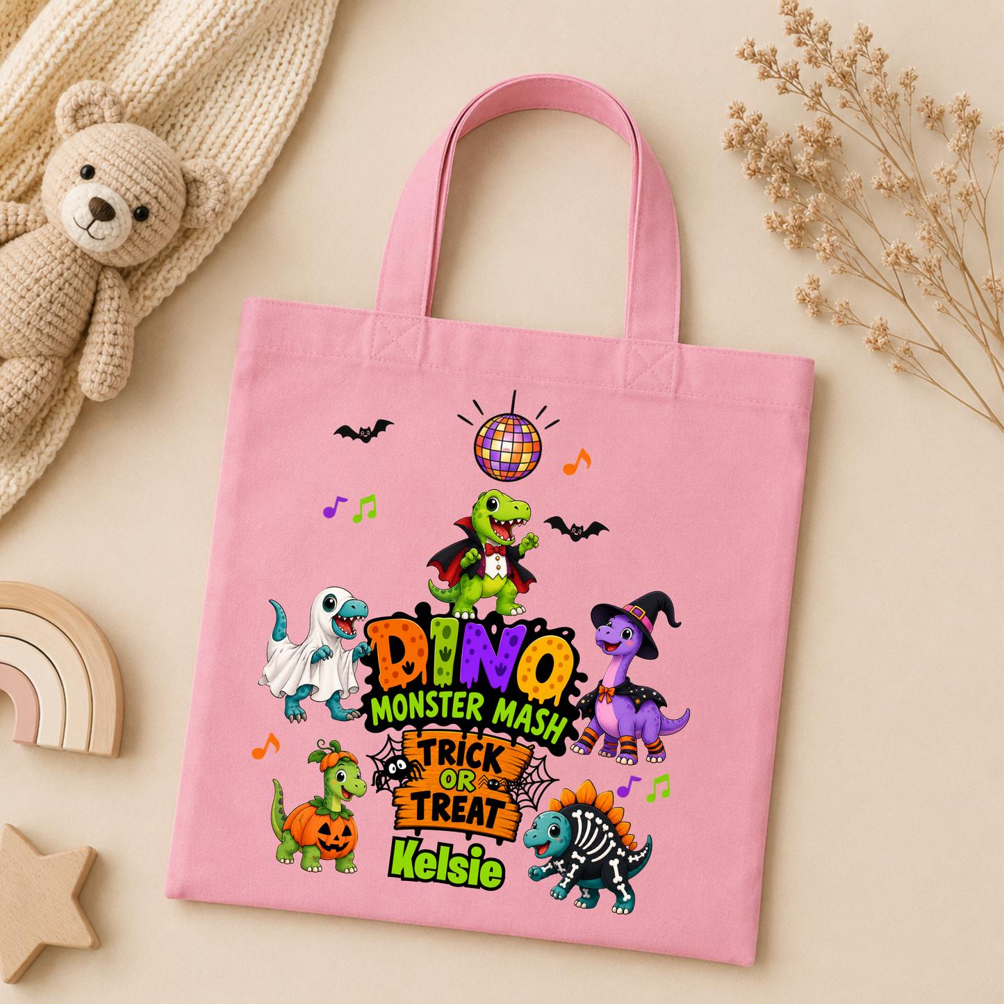 Personalised Halloween Bag with child's name, colourful Halloween dinosaurs and trick or treat design, available in green, pink and white.