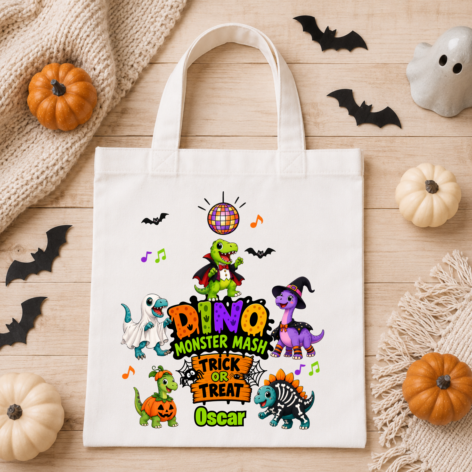 Personalised Halloween Bag with child's name, colourful Halloween dinosaurs and trick or treat design, available in green, pink and white.