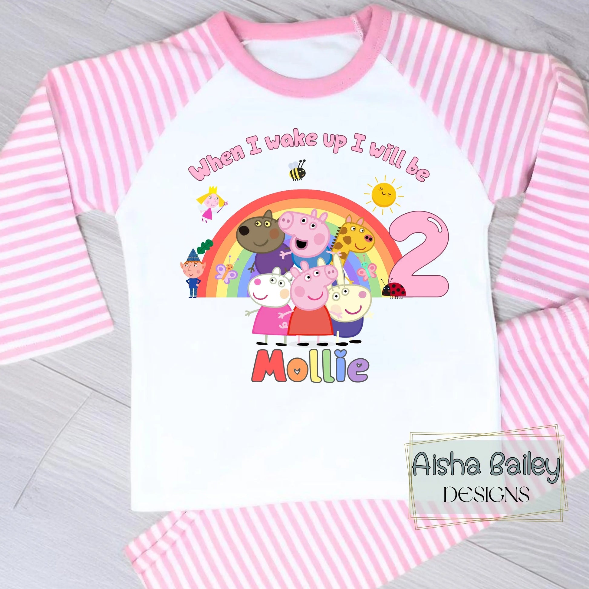 Pink Peppa Pig and friends personalised girls birthday pyjamas featuring a rainbow design and the text “When I wake up I will be with custom age and name, printed on a soft long-sleeve top and matching pink bottoms. Perfect personalised Peppa Pig birthday outfit for toddlers, ideal for first second third birthday celebrations, gifts, and bedtime photos.
