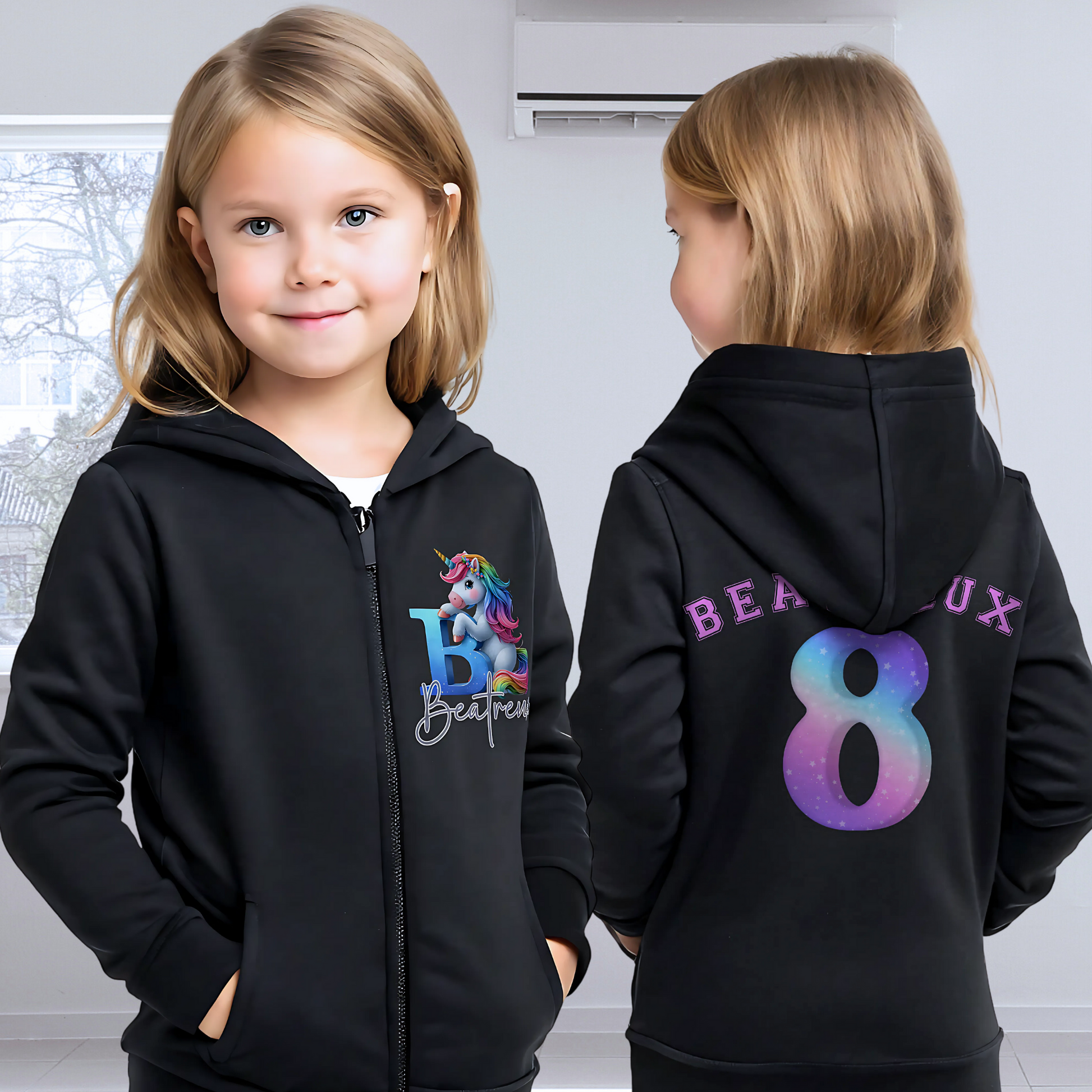 girls unicorn hoodie: A personalised girl's zip-up hoodie featuring a colourful unicorn graphic on the front, along with the girl's initial and name. The back showcases her name and favourite number. Perfect for a unicorn-themed birthday celebration! Custom girls hoodie, unicorn graphic jacket, personalised name and number hoodie, unicorn-themed apparel, birthday hoodie for girls.