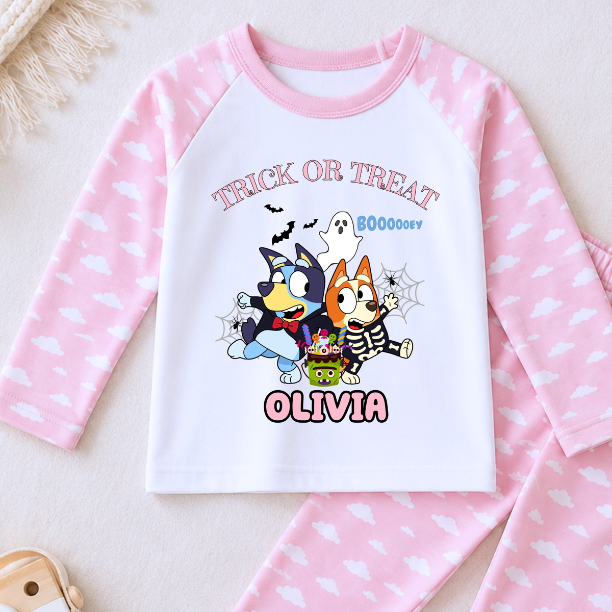 Girls personalised Bluey and Bingo Halloween pyjamas with name print and cute spooky design