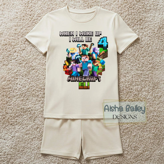 Minecraft Birthday Pyjama Shorts, Boy wearing personalised Minecraft birthday pyjamas with custom age on white t-shirt and matching shorts in a bright modern bedroom setting