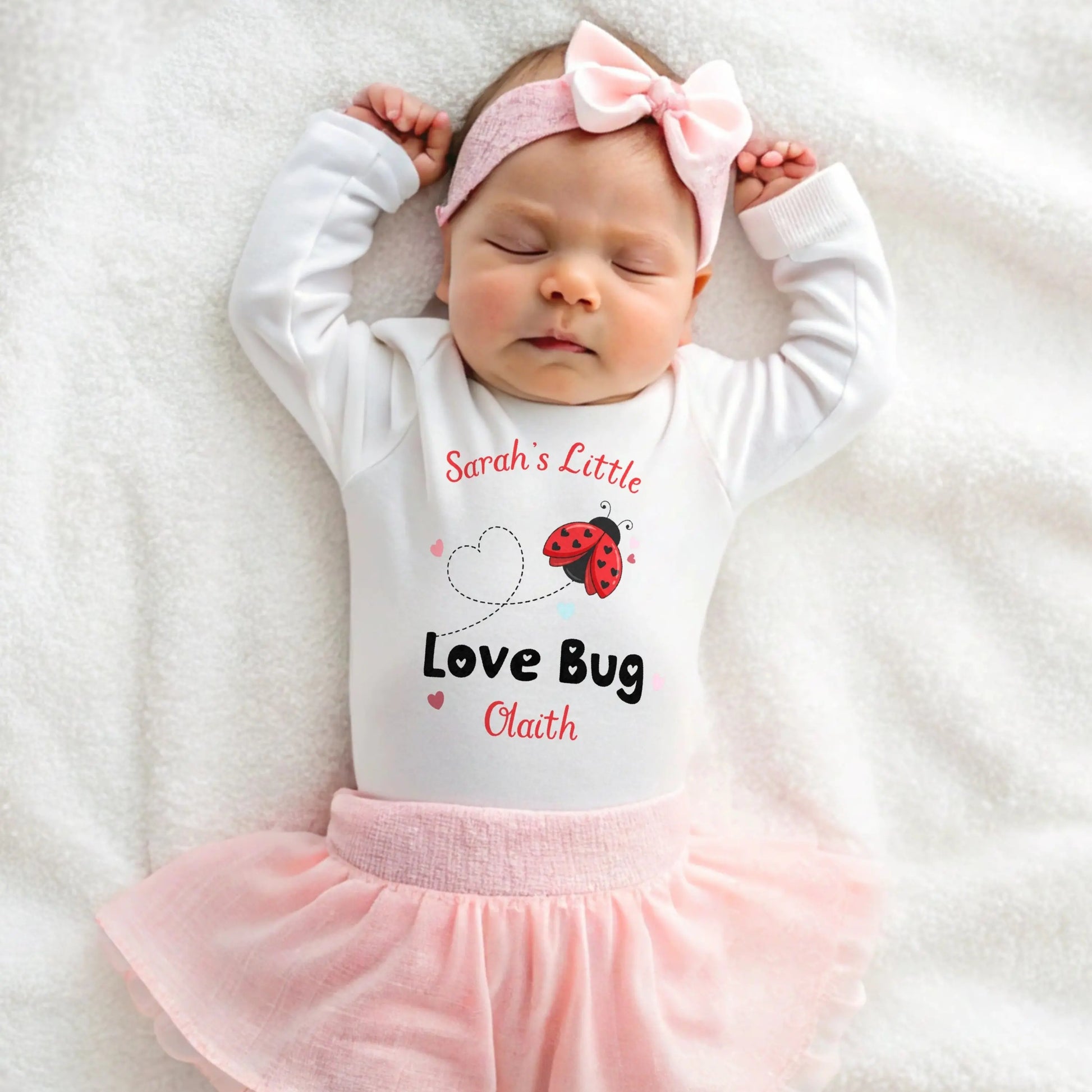 Valentine Baby Outfit personalised for Valentines day. Baby grow, vest and bib with a love bug (ladybird) design