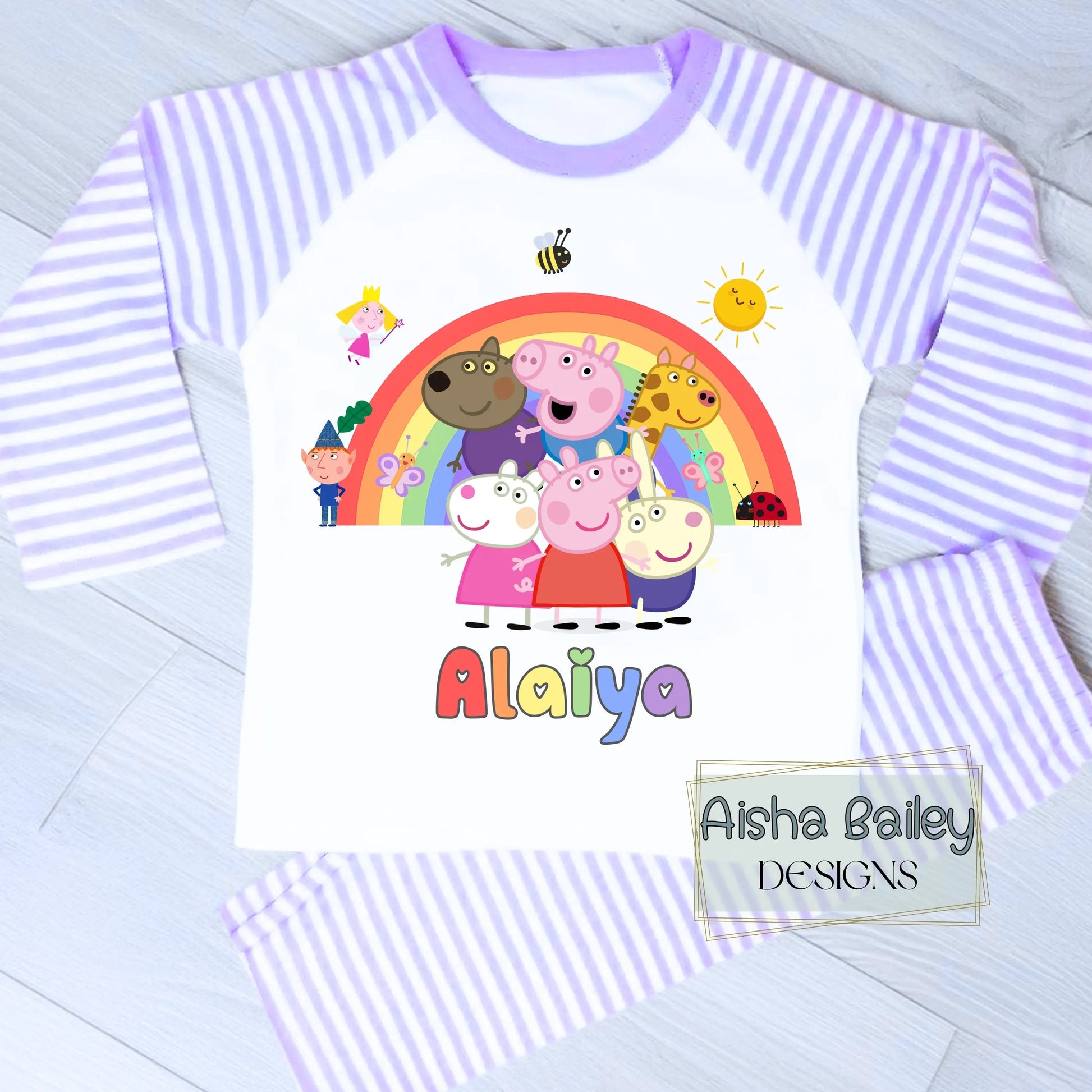 Pink Peppa Pig personalised girls pyjamas set featuring a colourful rainbow design and favourite Peppa Pig characters, customised with name and age. Made from soft, comfortable fabric with a long-sleeve top and matching cloud-print bottoms. Perfect for everyday wear, cosy nights, and relaxed mornings—ideal personalised Peppa Pig sleepwear for toddlers and young children.