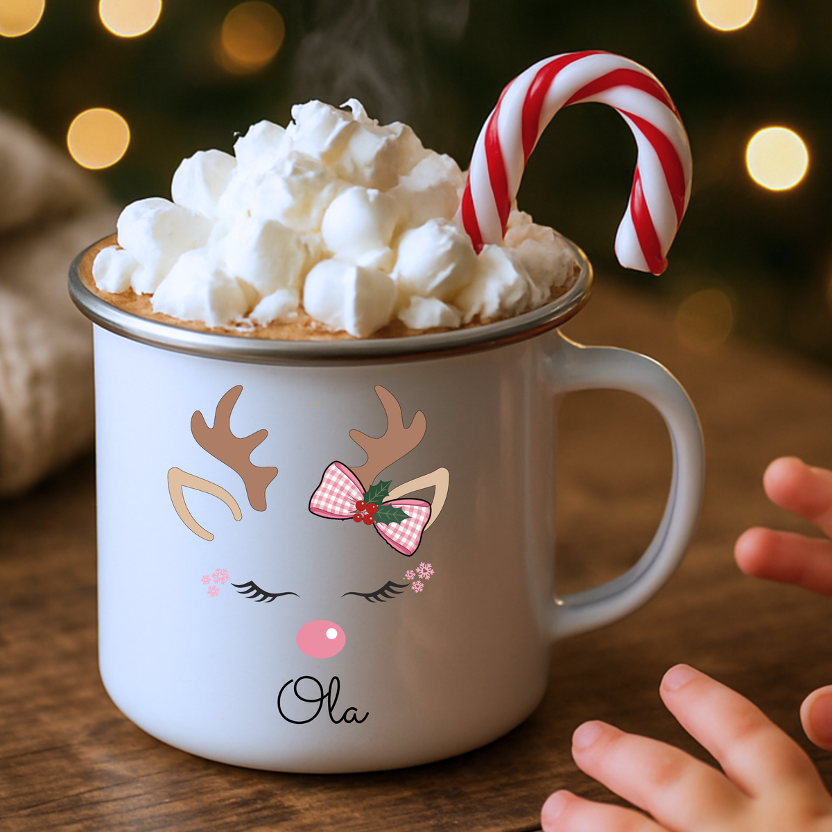 Personalised reindeer Christmas mug for girls featuring a pink bow and child’s name, available in polymer, ceramic and campervan styles.