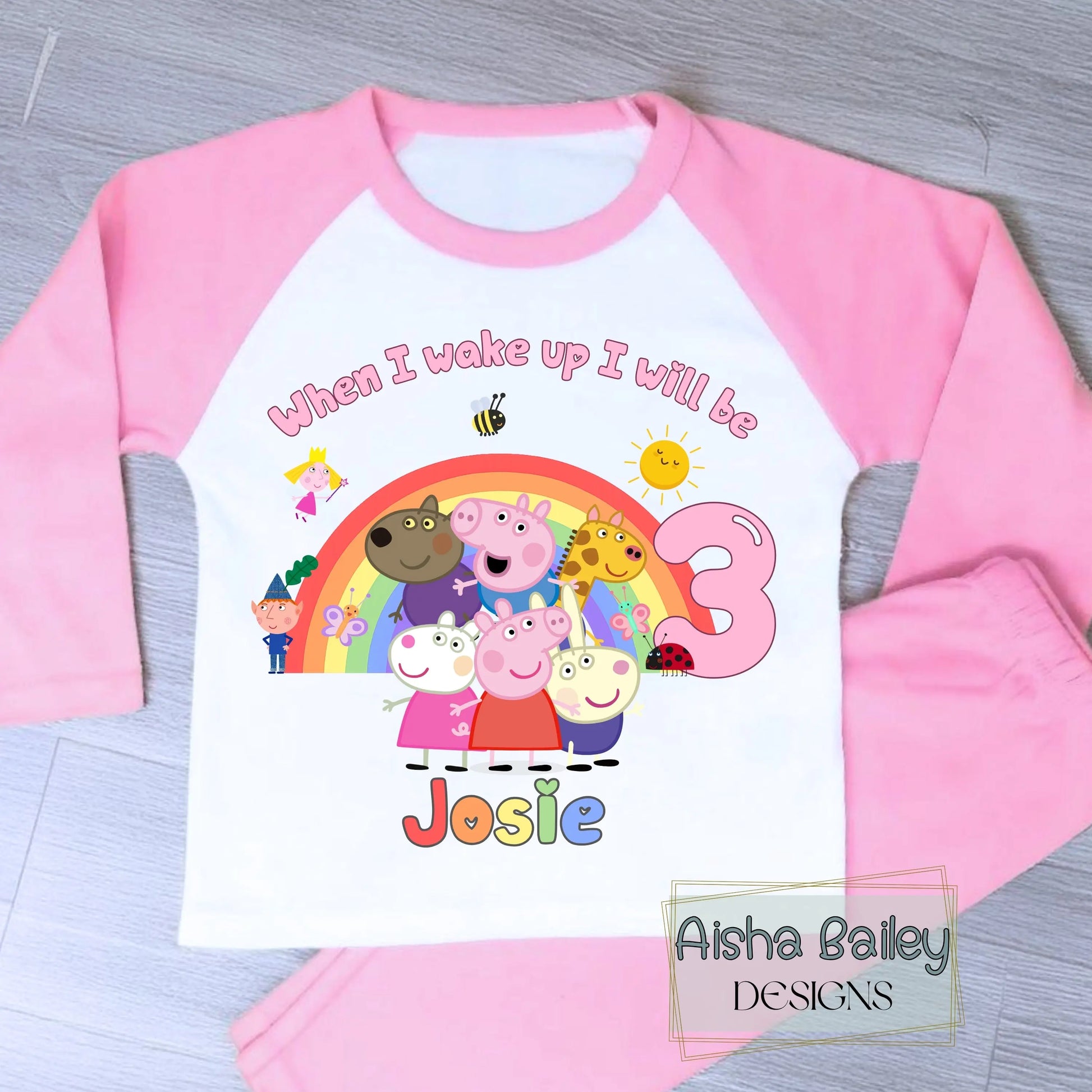 Pink Peppa Pig and friends personalised girls birthday pyjamas featuring a rainbow design and the text “When I wake up I will be with custom age and name, printed on a soft long-sleeve top and matching pink bottoms. Perfect personalised Peppa Pig birthday outfit for toddlers, ideal for first second third birthday celebrations, gifts, and bedtime photos.
