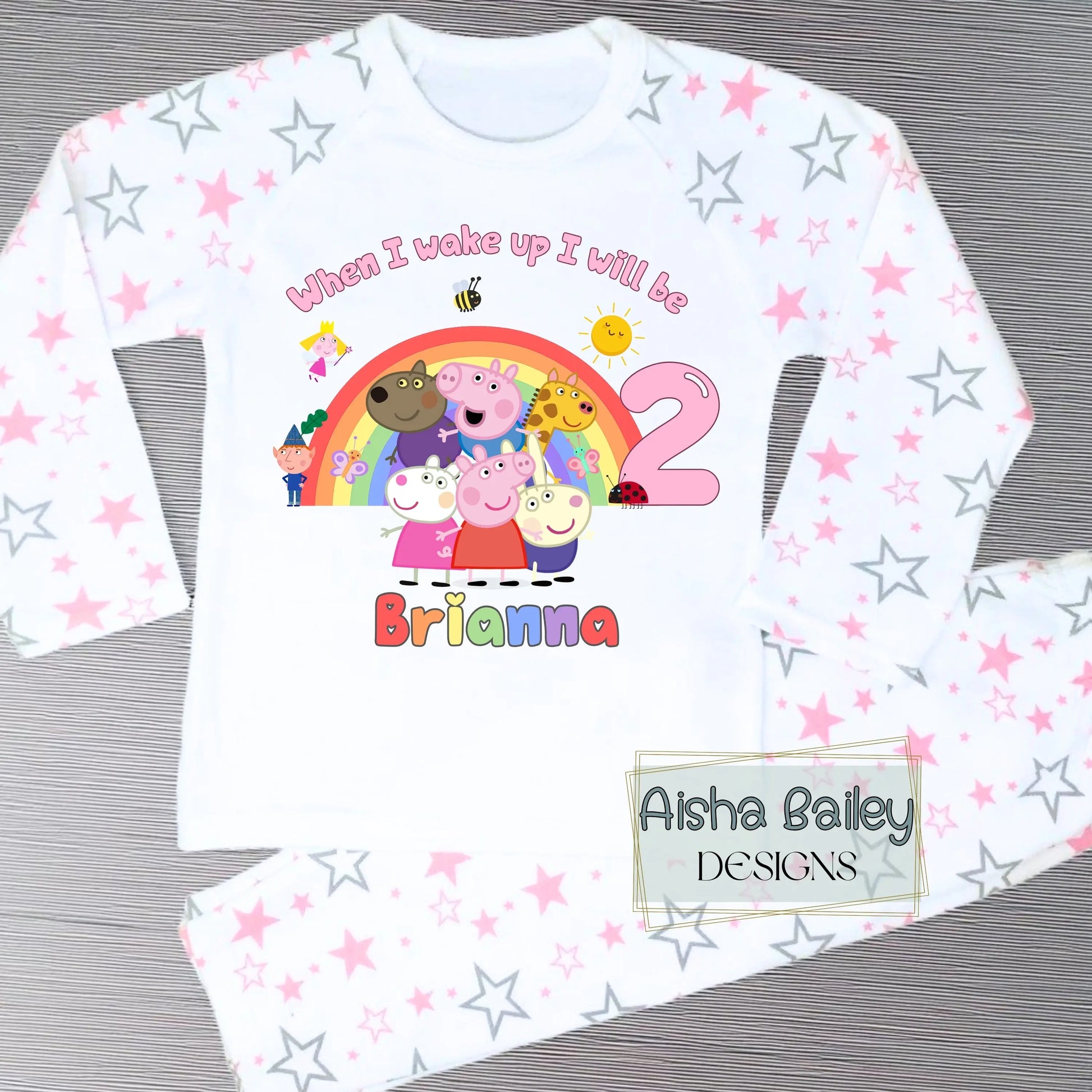 Pink Peppa Pig and friends personalised girls birthday pyjamas featuring a rainbow design and the text “When I wake up I will be with custom age and name, printed on a soft long-sleeve top and matching pink bottoms. Perfect personalised Peppa Pig birthday outfit for toddlers, ideal for first second third birthday celebrations, gifts, and bedtime photos.