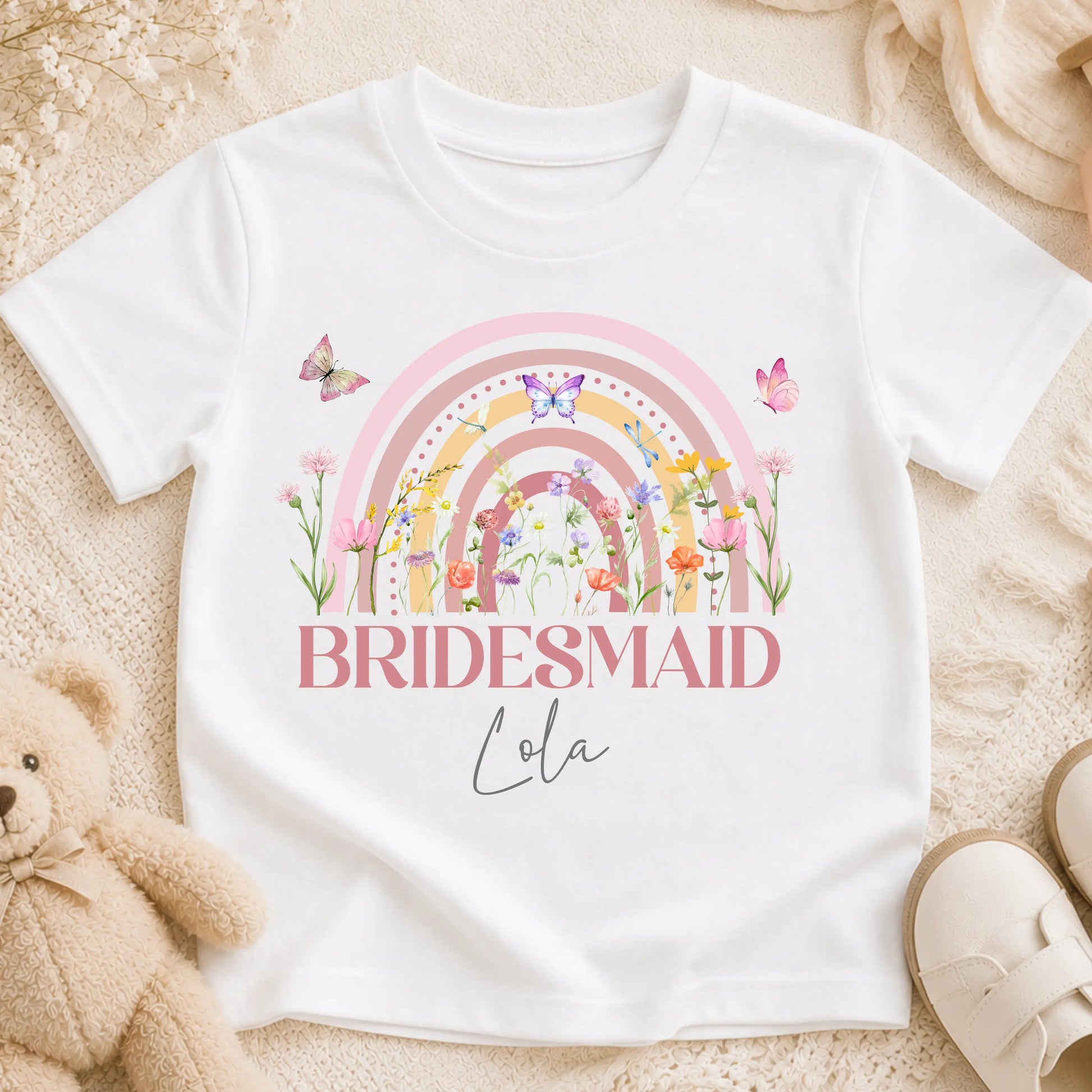 Personalised flower girl T-Shirt or sweatshirt with boho rainbow floral design, butterflies, custom name, and wedding role for children’s wedding outfits.
