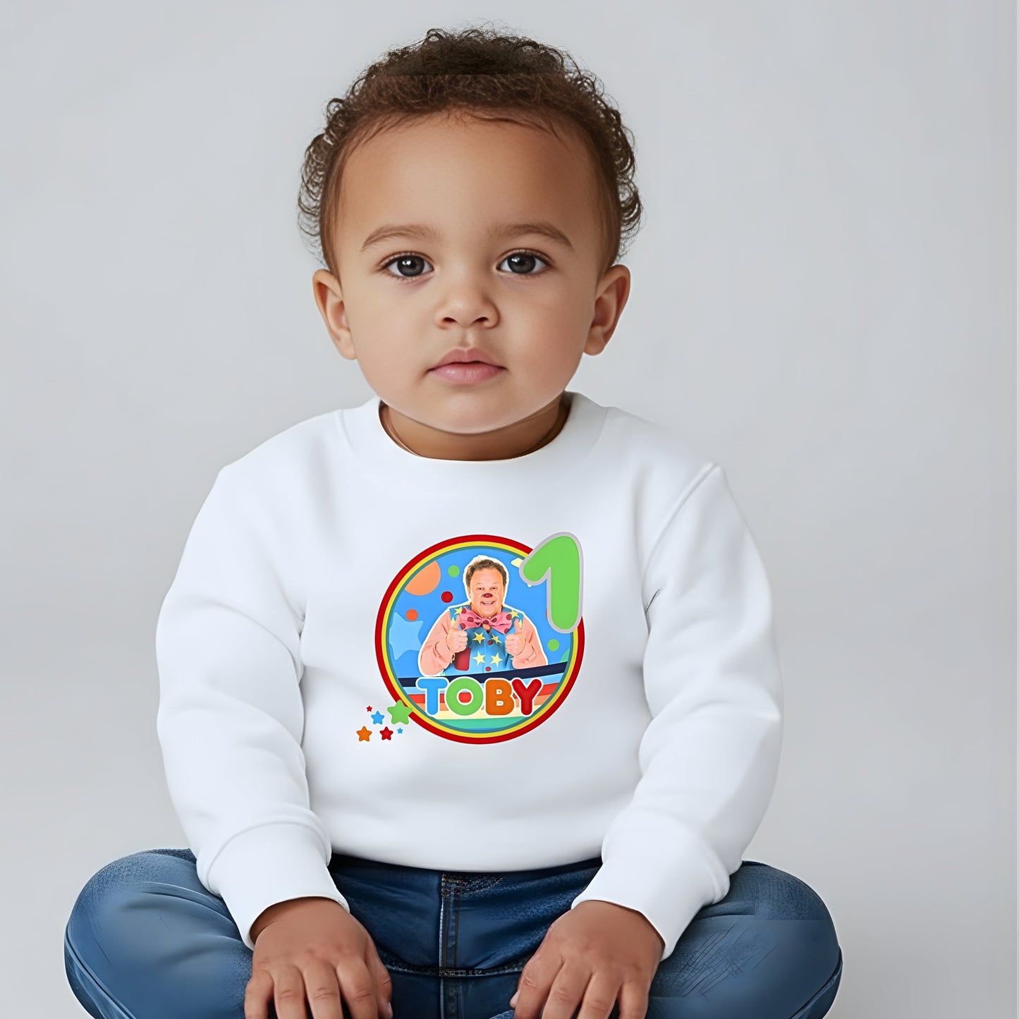 Mr Tumble birthday sweatshirt for kids featuring colourful character design, personalised name option, and bright festive details.