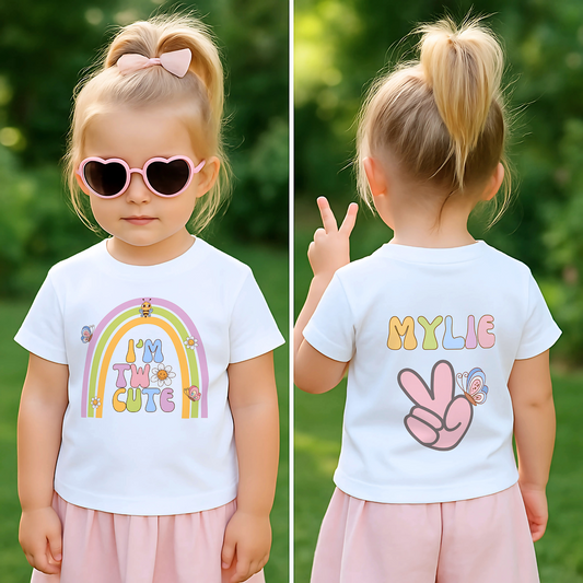 Two cute birthday t-shirt: An adorable birthday T-shirt for two year old girls featuring a whimsical boho retro rainbow on the front, complemented by nostalgic retro emojis and a groovy font. Crafted from soft, high-quality fabric for comfort, this vibrant tee is perfect for standing out during birthday celebrations or casual outings. 2nd birthday outfit