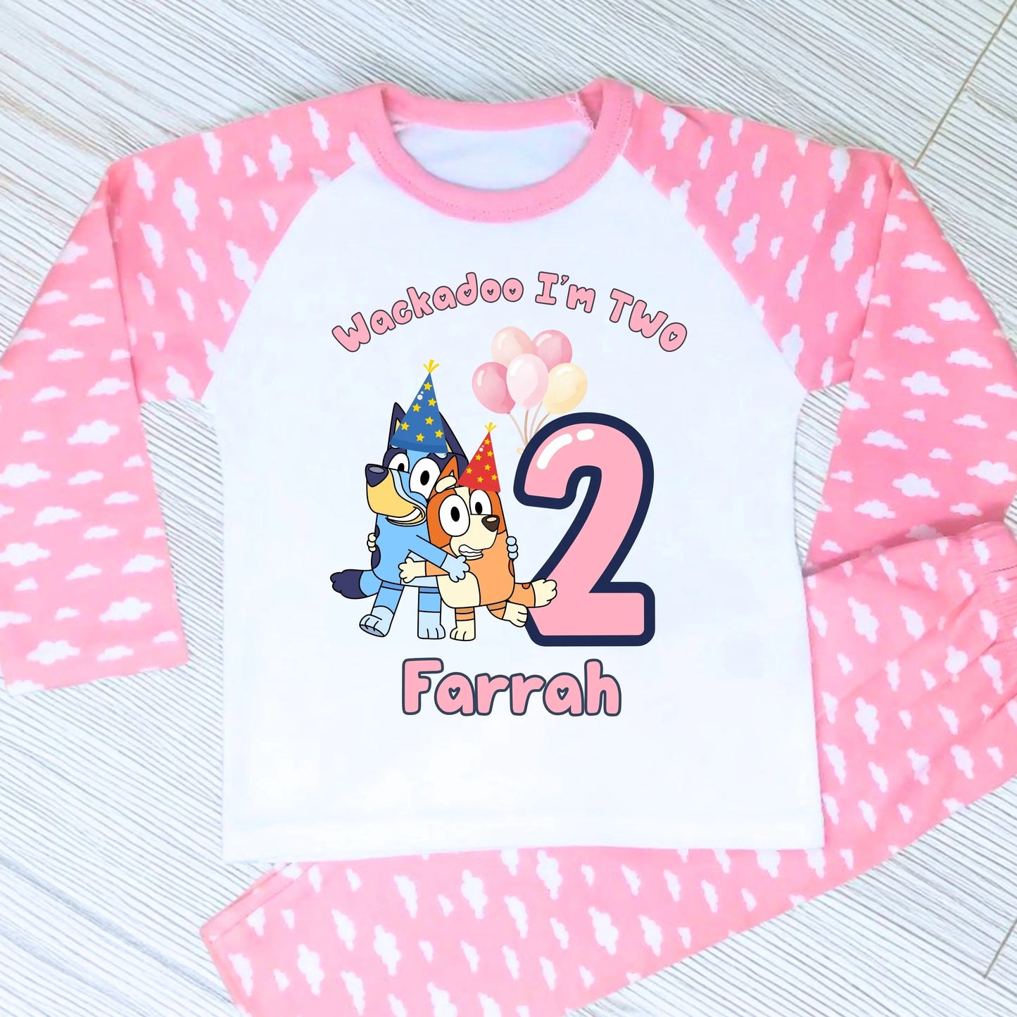 Bluey and Bingo Birthday Pyjamas for Girls with custom name and age in a pink party-themed design.