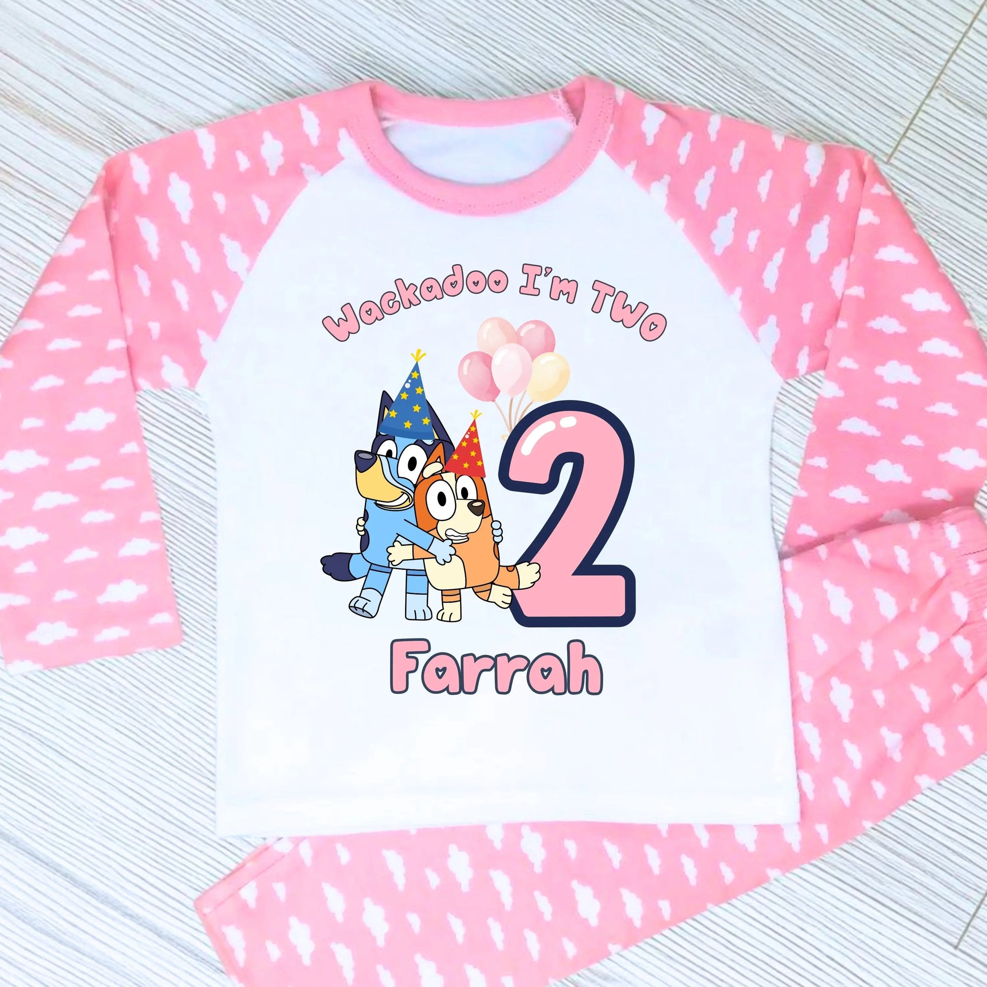 Bluey and Bingo Birthday Pyjamas for Girls with custom name and age in a pink party-themed design.