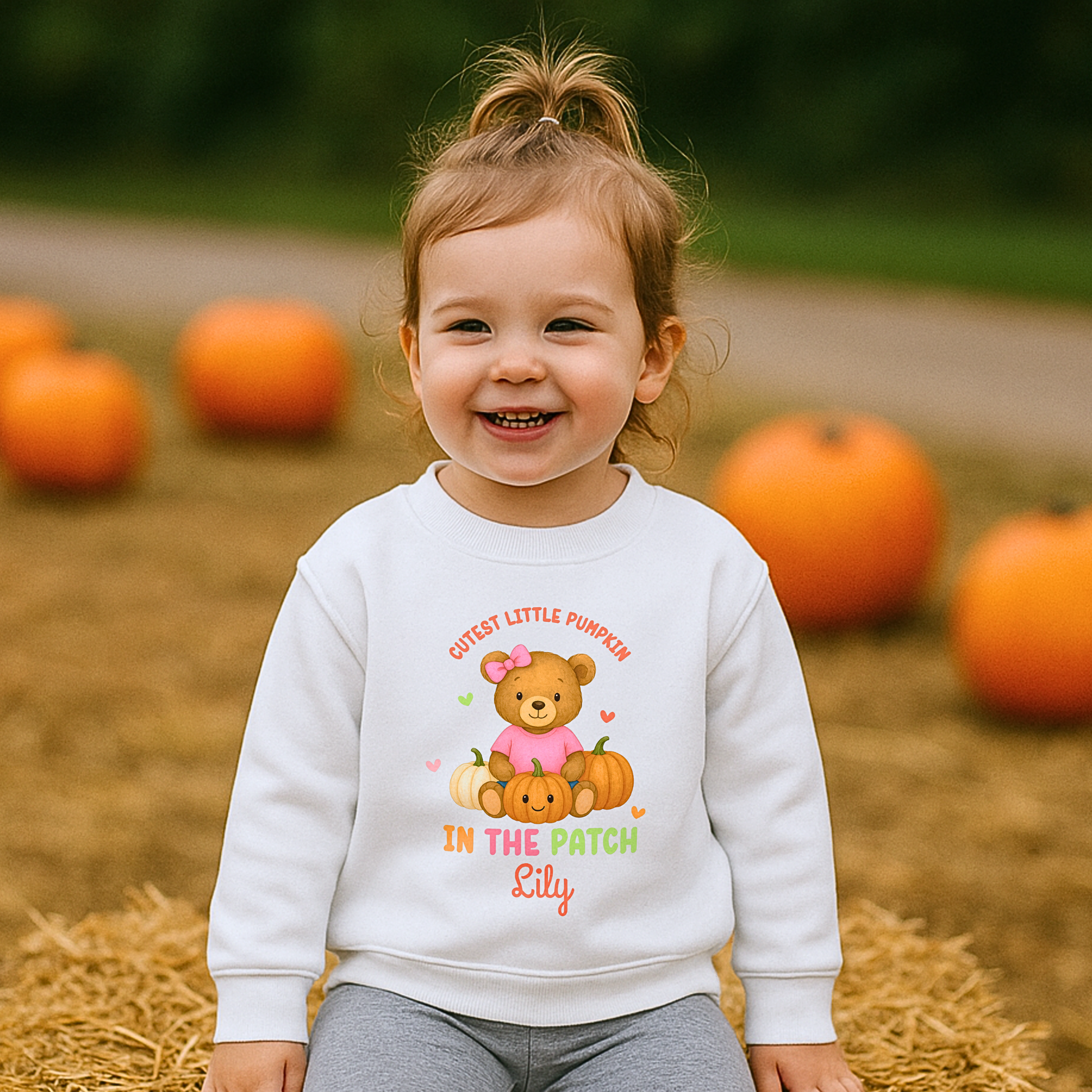 Personalised Halloween sweatshirt for kids with teddy bear and “Cutest Pumpkin in the Patch” design.