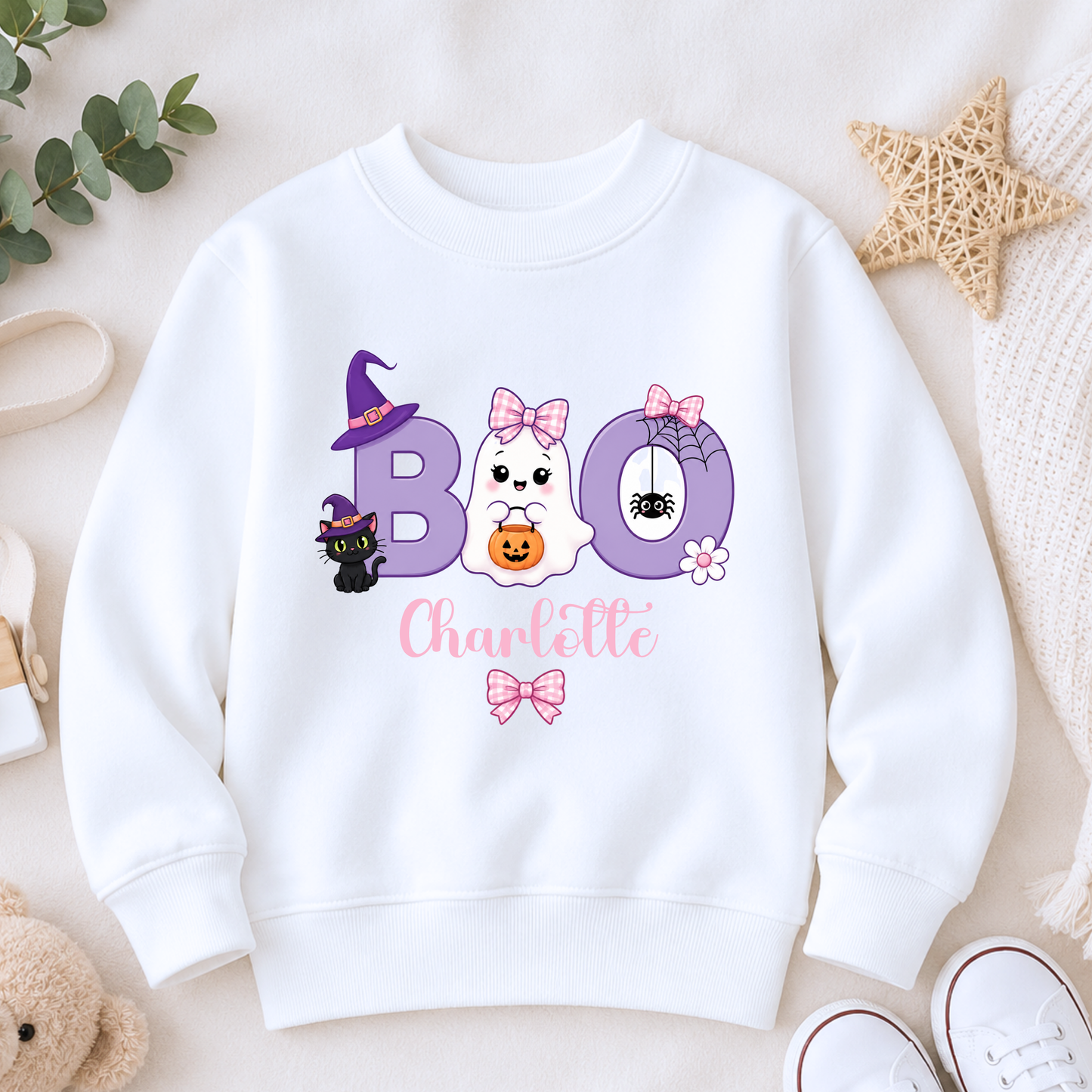Personalised Halloween Sweatshirt for Girls featuring a cute ghost with bow, playful Boo design and custom name, available in three colours.