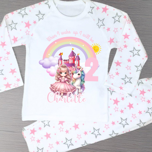 Princess Birthday Pyjamas: A pink and white long-sleeved pyjama set with a rainbow, castle, unicorn, and a princess in a pink dress. The top has the text 'When I wake up I will be with age and name. It will be a perfect personalised gift for a girls birthday to compliment a princess unicorn birthday party.