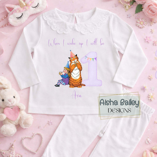 Personalised girls The Tiger Who Came For Tea birthday pyjamas with child’s name and age, featuring storybook tiger illustration and purple number design on soft cotton set.