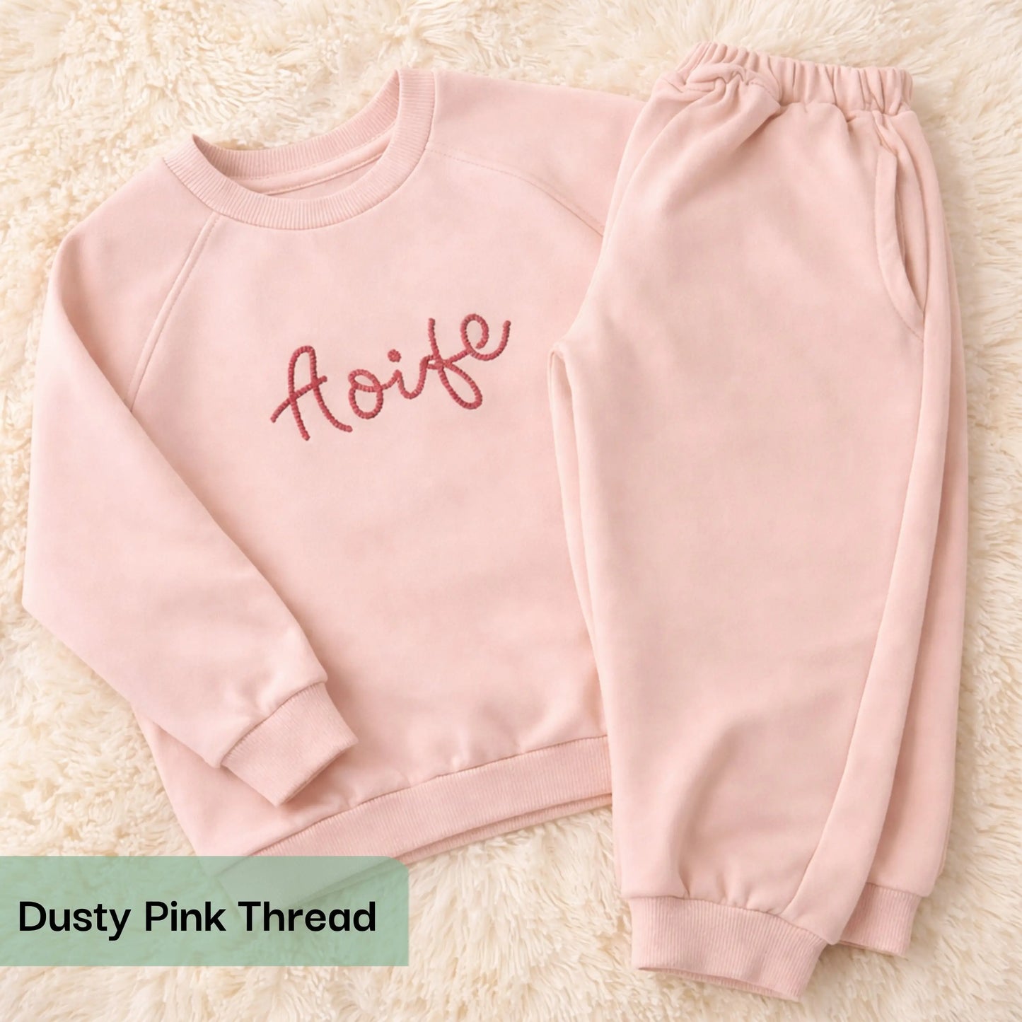 Personalised embroidered loungewear with a name: A child wearing a loungewear set with their name displayed on the front. Perfect for Christmas and birthday gifting