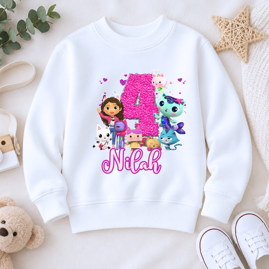 Personalised Gabby's Dollhouse Birthday Sweatshirt for Girls: A custom name and age sweatshirt for a girl's birthday Gabby's Dollhouse themed