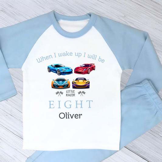 little racer birthday pyjamas - Personalised Boys Racing Car Birthday PJs. A vibrant cotton two piece set designed for little racers, featuring a playful sports car print. Perfect for birthday parties or everyday wear, this shirt is customised to make your child feel like a racing champion. On the top it has the writing when i wake up i will be with their number of age. It has four sports car and their name under the design. Great for birthday boys that love sports cars.