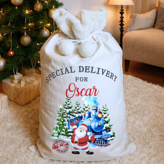 personalised christmas sack, Personalized Christmas gift sack with Santa and train design, placed in a cozy living room with a decorated tree.