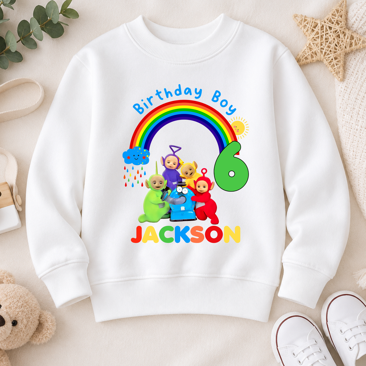 Personalised Boys Teletubbies Birthday Sweatshirt with rainbow design, custom name and age, available in white, blue and green.