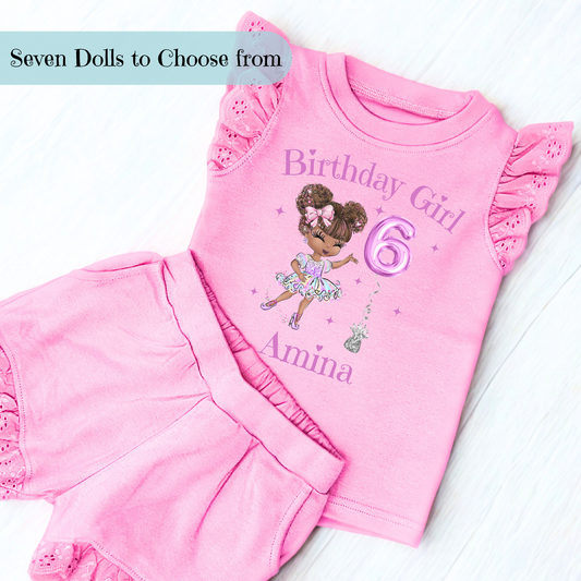 A vibrant and colourful personalised birthday outfit for girls, featuring a glitter-like design reminiscent of a pop star's ensemble. The set includes frilly shorts and a matching top, both adorned with rainbow hues, offering a playful and festive look. This personalised birthday girl outfit is perfect for a birthday celebration, capturing the spirit of fun and fashion. It also comes with a custom rainbow doll in the design, making it an ideal gift for young fashion enthusiasts.