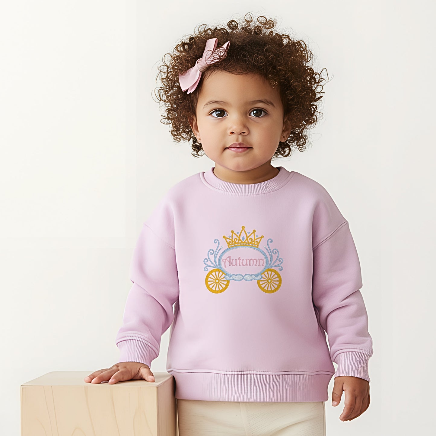 Princess Embroidered sweatshirt: Baby wearing a personalised embroidered princess carriage sweatshirt for girls made with premium threads and detailed stitching.