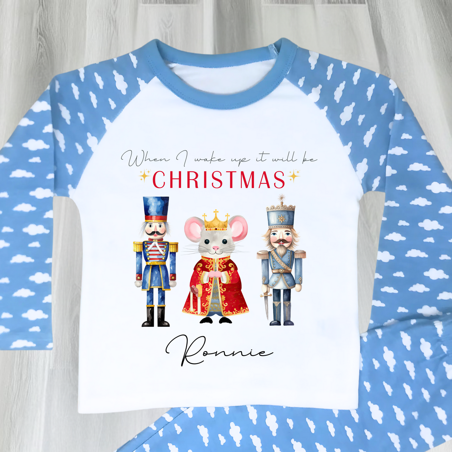 Nutcracker christmas pyjamas, A set of personalised boys Nutcracker-themed Christmas pyjamas, featuring the festive phrase “When I Wake Up It Will Be Christmas.” These cosy christmas pyjamas are adorned with whimsical Nutcracker illustrations, perfect for adding a touch of magic to a child's Christmas Eve: personalized, boys, Nutcracker, Christmas pyjamas, festive, holiday, cosy, magical.