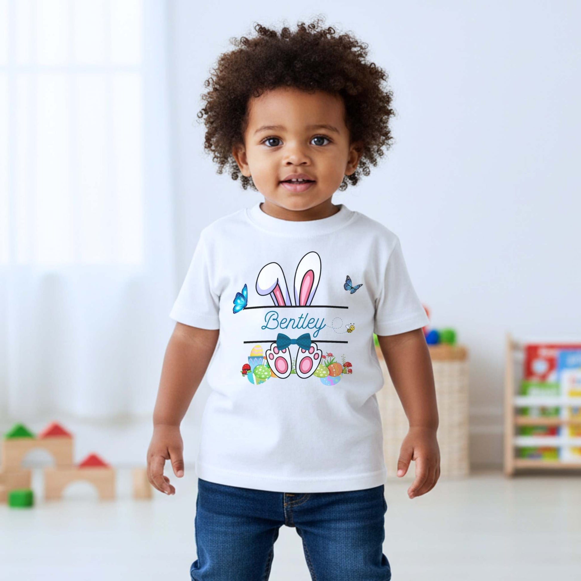 Boys Easter top with personalised split monogram bunny design, available as t-shirt or sweatshirt. Custom name Easter top