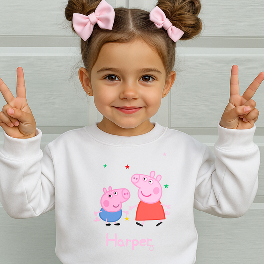 Personalised Peppa and George Sweatshirt: Child wearing a personalised Peppa and George Pig white sweatshirt with her custom name printed on it.