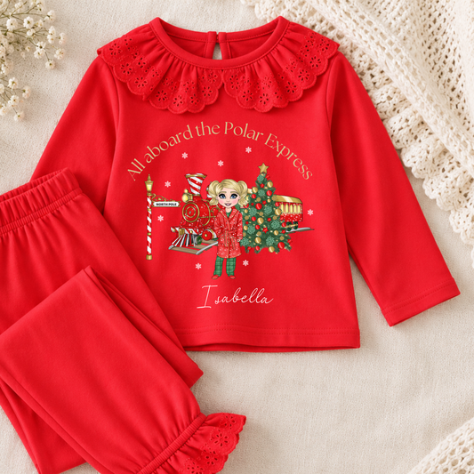 Personalised Christmas Pyjamas for girls with frill detail, custom name, Christmas doll, festive train and Christmas tree design.