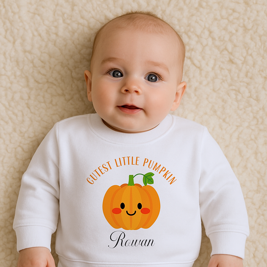 Personalised halloween sweatshirt: Toddler wearing a personalised Halloween pumpkin sweatshirt that says "Cutest Little Pumpkin", Personalised Halloween Jumper, Toddler pumpkin jumper