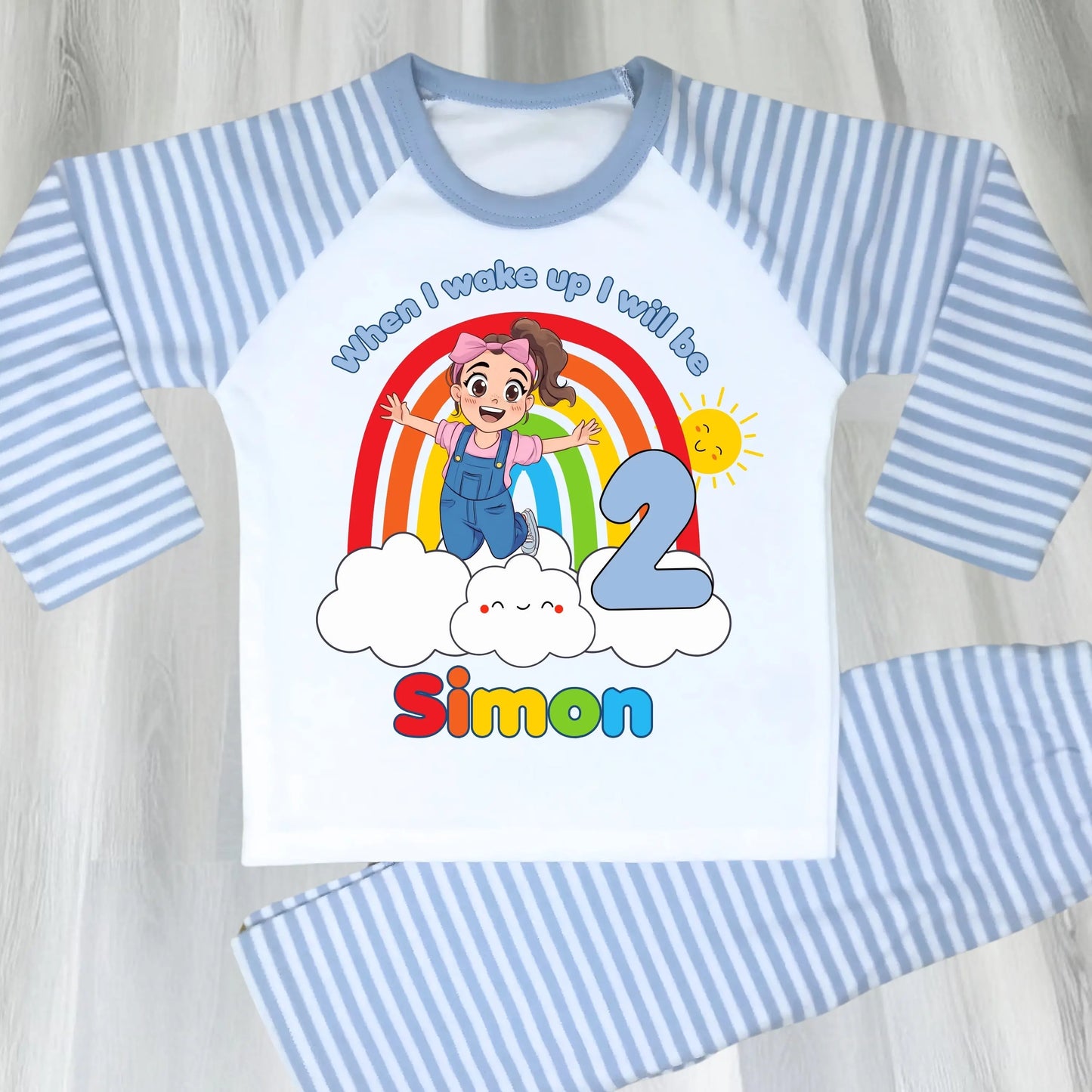 Personalised boys Ms Rachel birthday pyjamas with rainbow design and name printed on top