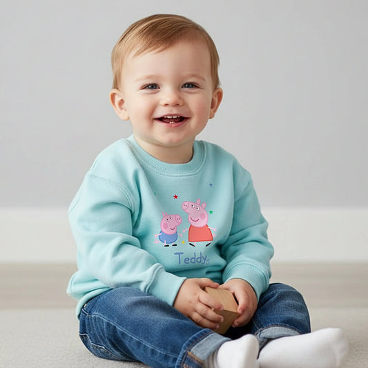 Personalised Peppa and George Sweatshirt: Child wearing a personalised Peppa and George Pig white sweatshirt with her custom name printed on it.