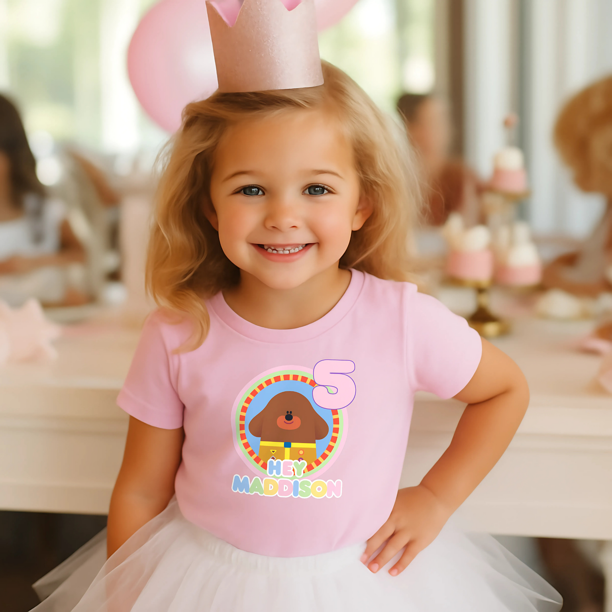 Hey Duggee Badge Birthday T-shirt: A lively and vibrant birthday t-shirt featuring the beloved character Hey Duggee, perfect for a child's special day. The shirt is customisable with the child's name and age, making it a personal keepsake. Made from 100% cotton, it promises comfort and durability for active play. The design's bright colours and the iconic Hey Duggee badge add a delightful touch that reflects the child's unique personality and love for the popular children's series.