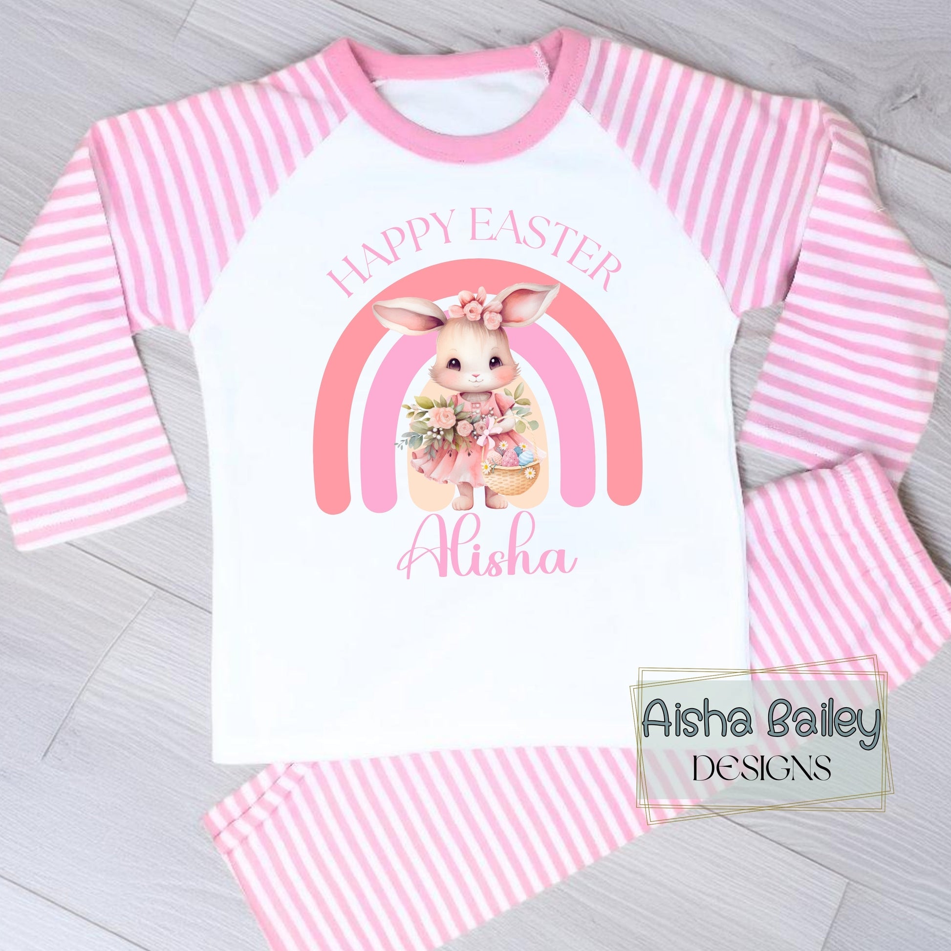 Personalised Easter Pyjamas for girls with their custom name. Bunny Rainbow design in soft pink pastel tones