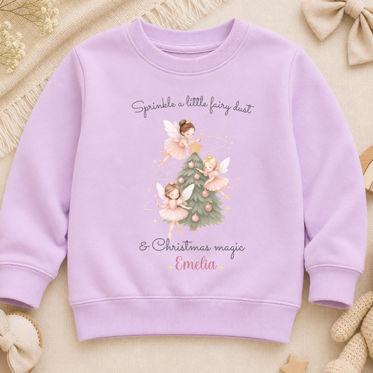 Girls Christmas Sweatshirt with personalised name, featuring three pink fairies decorating a festive Christmas tree with soft pink baubles.