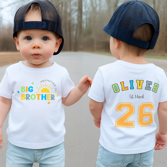 Promoted to big brother t-shirt: A boys personalised promoted to big brother pregnancy announcement t-shirt featuring the phrase &quot;I am going to be a Big Brother&quot; in vibrant rainbow colours. This is designed to celebrate a big or bigger brother role.  Customisable with a special date, it serves as a keepsake for capturing precious sibling moments and marking the start of a new journey. Perfect for sharing the exciting news with family and the world. Matching Sibling, Big Brother Shirt