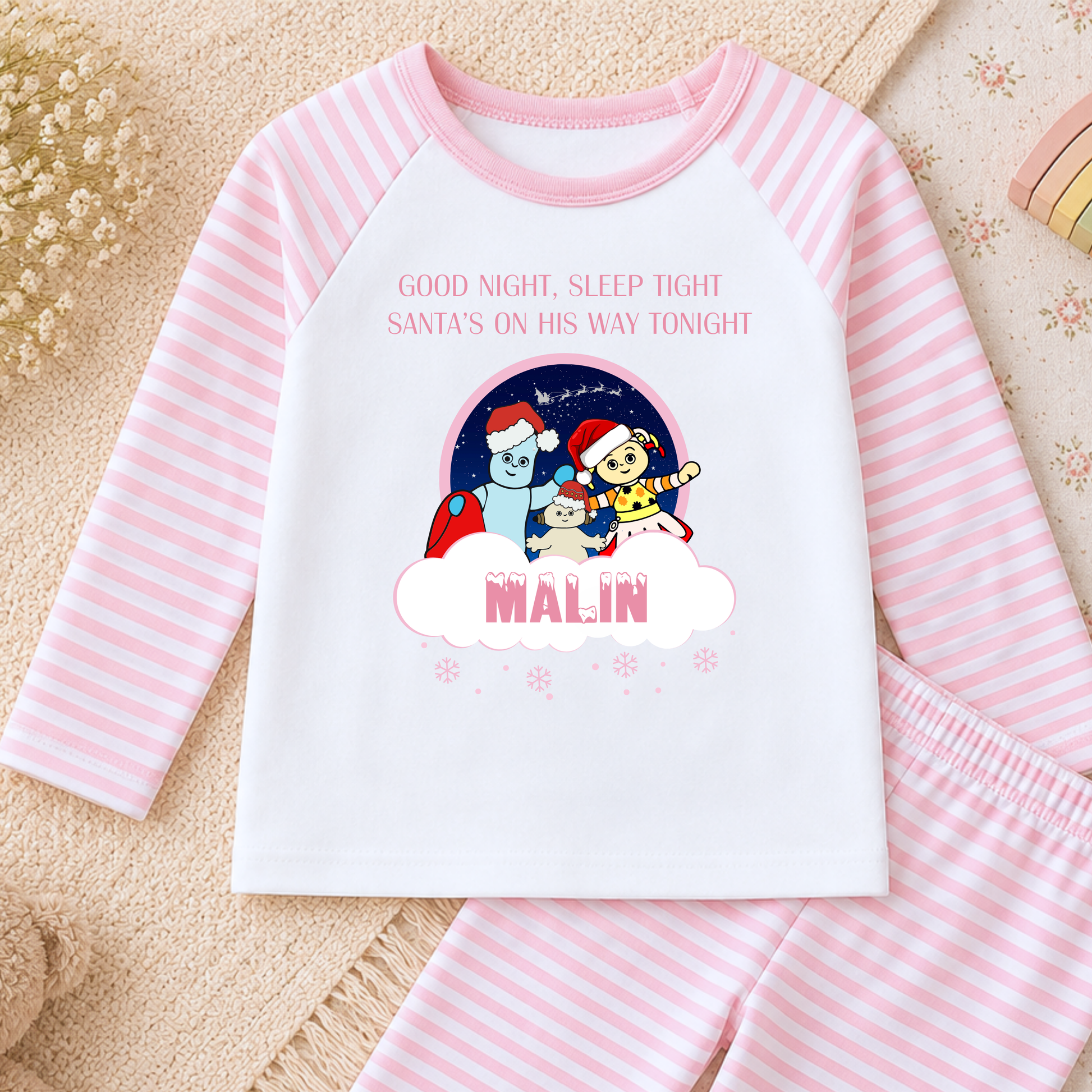 Girls Christmas Pyjamas personalised with name, featuring In the Night Garden characters Igglepiggle, Upsy Daisy and Makka Pakka in a festive design.