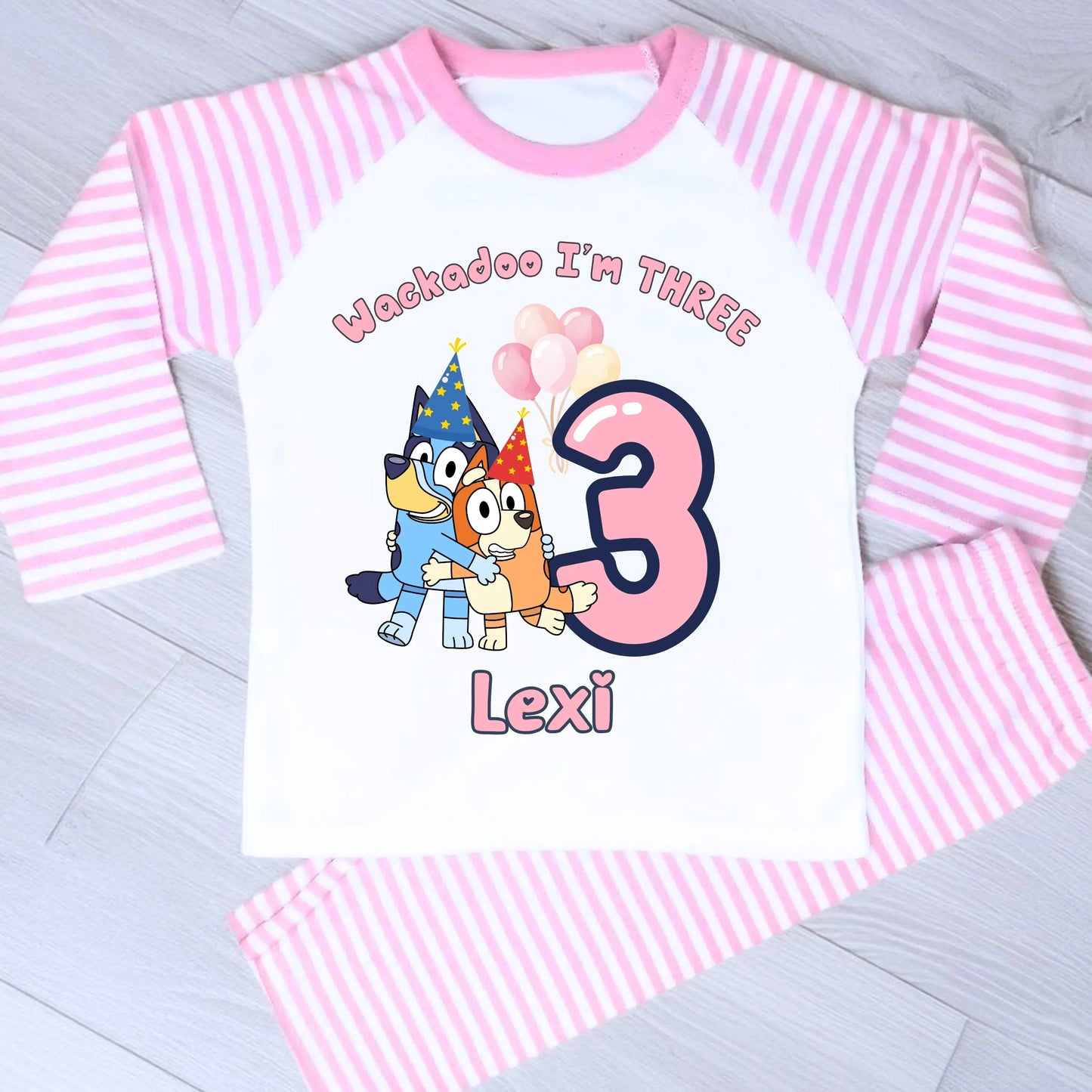 Bluey and Bingo Birthday Pyjamas for Girls with custom name and age in a pink party-themed design.