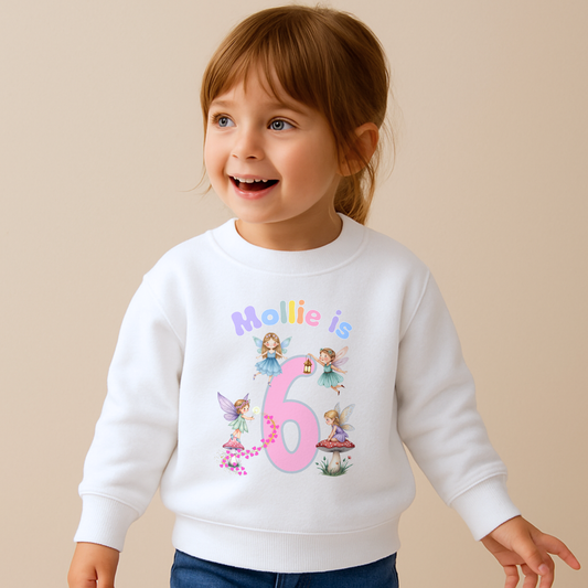 personalised fairy birthday sweatshirt for girls. Custom name & age design, perfect magical birthday outfit or gift for toddlers and children.