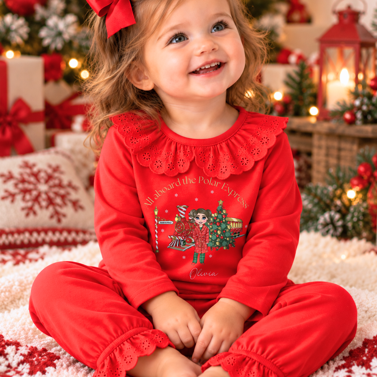 Personalised Christmas Pyjamas for girls with frill detail, custom name, Christmas doll, festive train and Christmas tree design.
