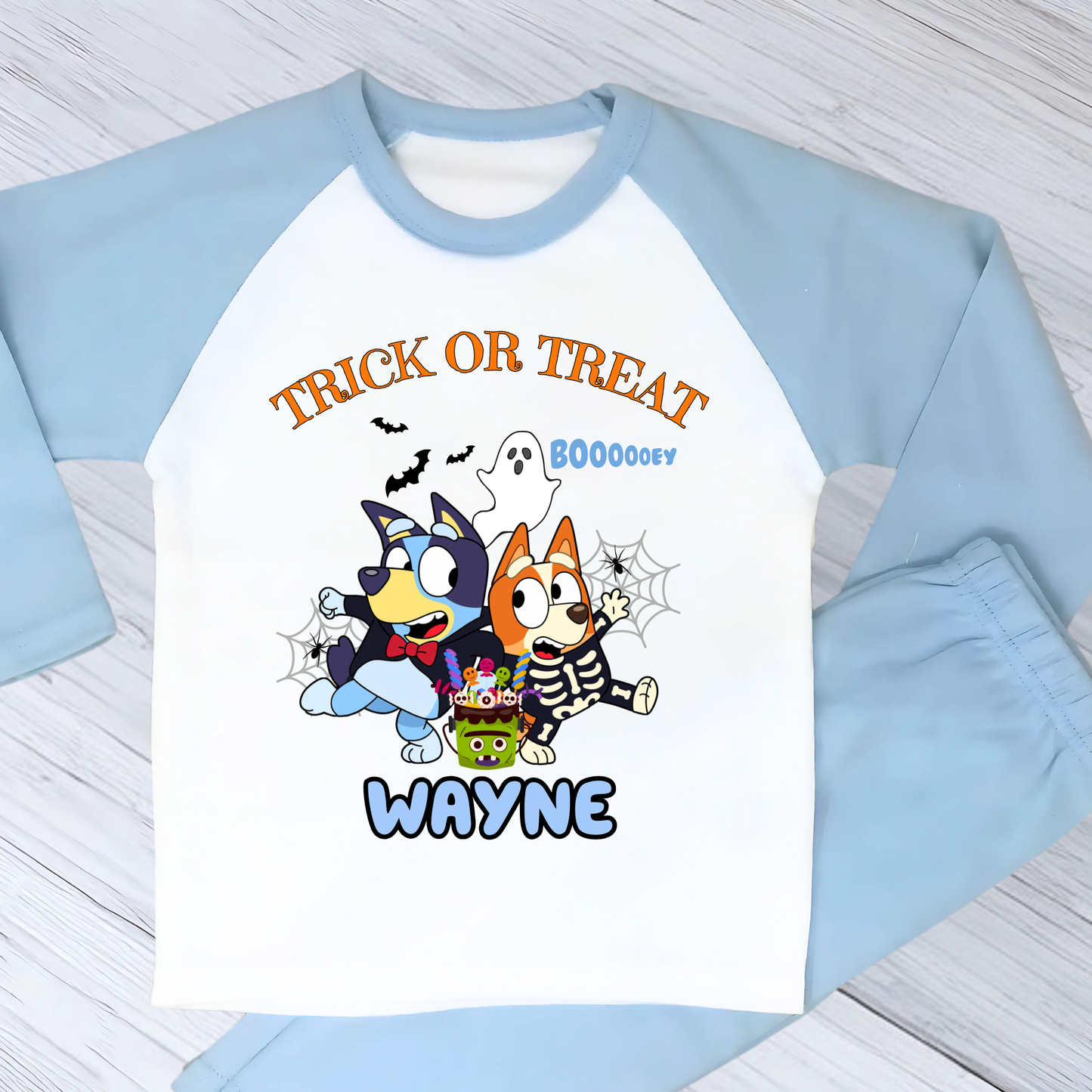 Boys personalised Bluey and Bingo Halloween pyjamas with name print and cute spooky design
