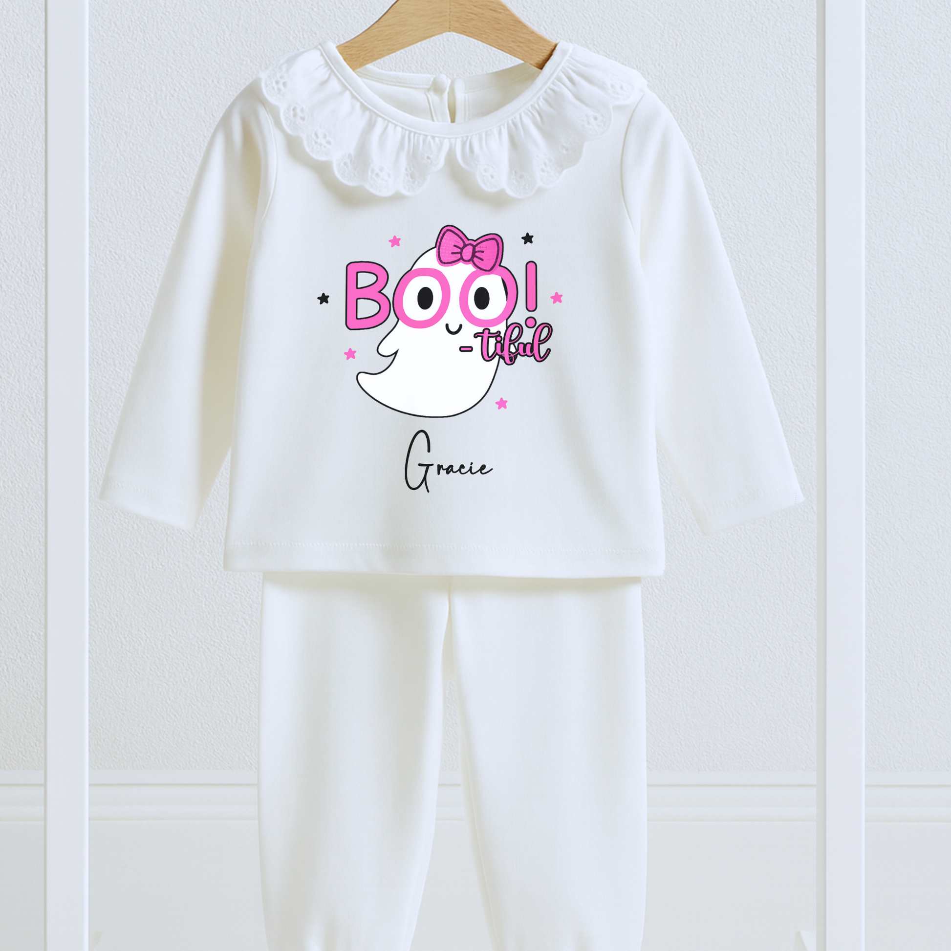 Personalised Halloween pyjamas for girls with “Boo-tiful” ghost design on white frill set.