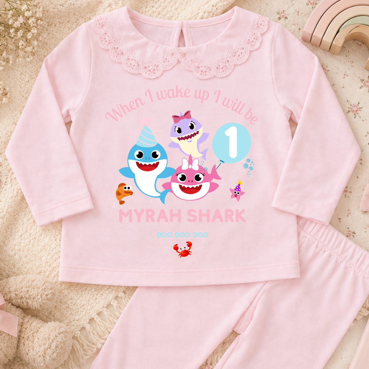Personalised Baby Shark Birthday Pyjamas for Girls, white long sleeve PJs with pink and blue shark design, birthday age and custom name
