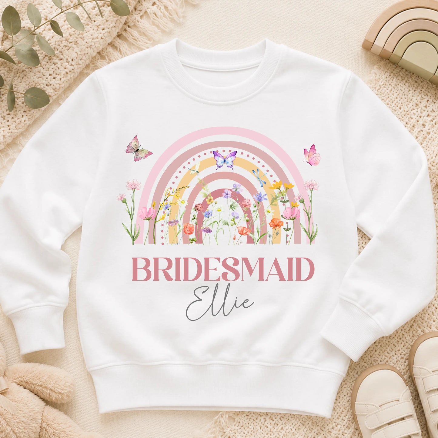 Personalised flower girl T-Shirt or sweatshirt with boho rainbow floral design, butterflies, custom name, and wedding role for children’s wedding outfits.