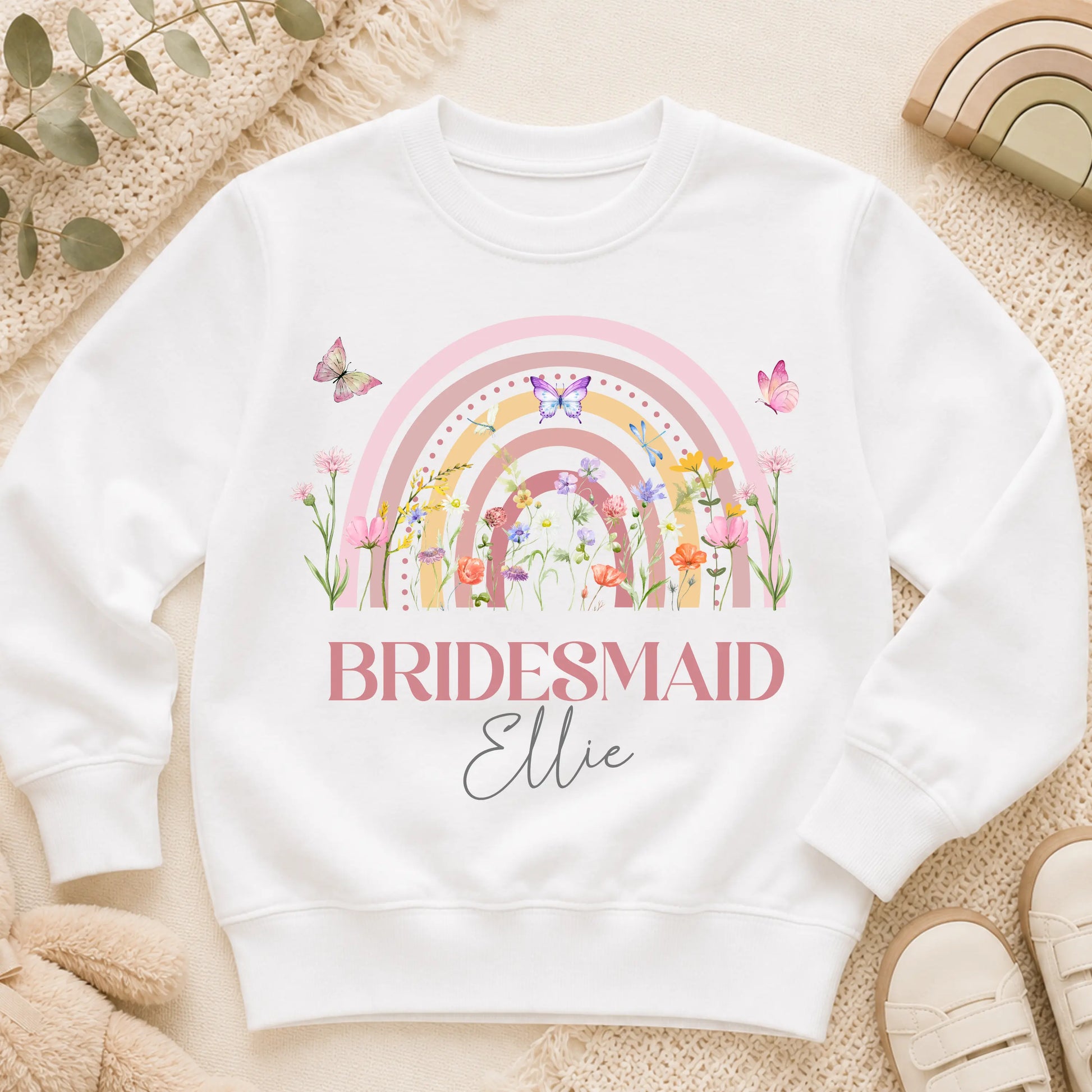 Personalised flower girl T-Shirt or sweatshirt with boho rainbow floral design, butterflies, custom name, and wedding role for children’s wedding outfits.