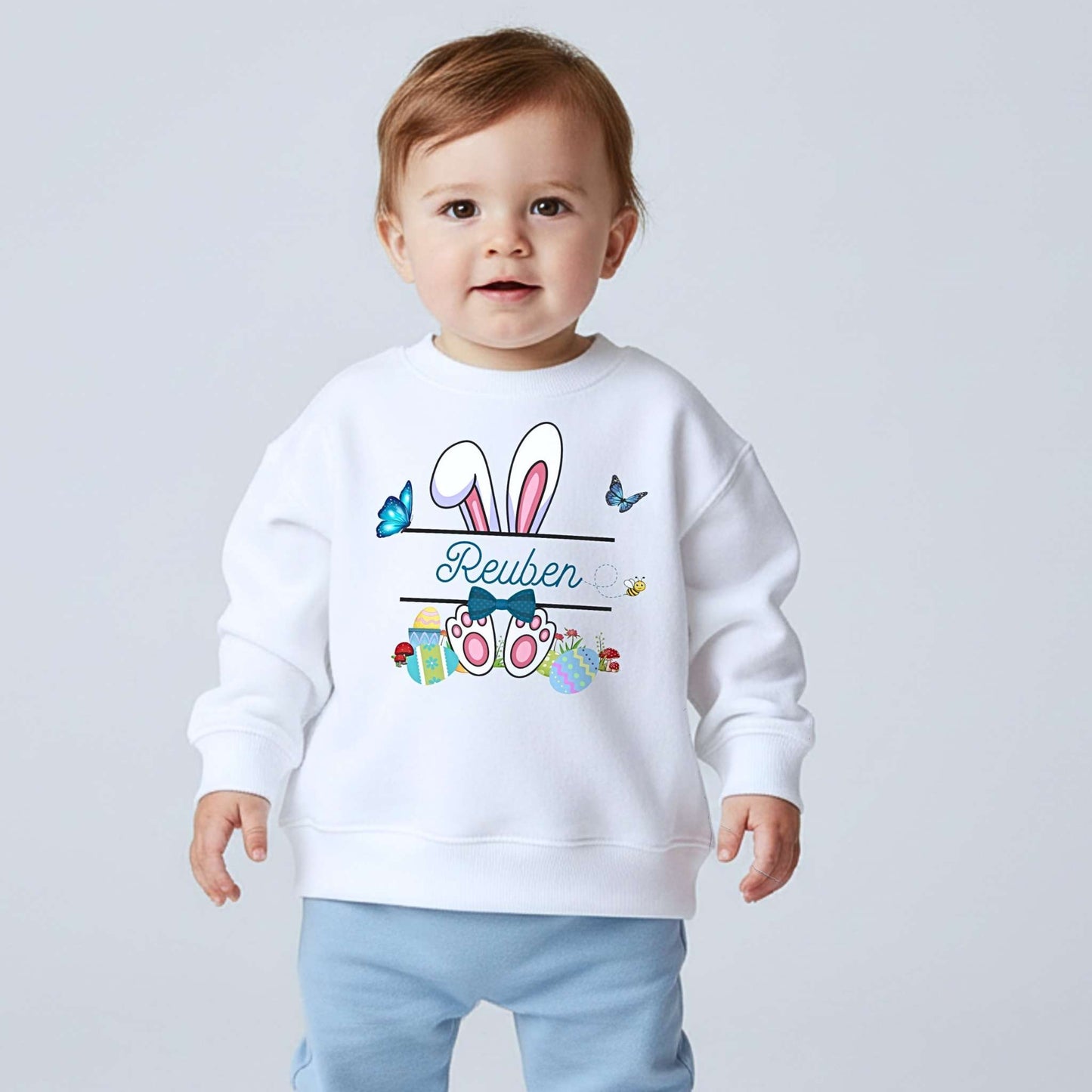 Boys Easter top with personalised split monogram bunny design, available as t-shirt or sweatshirt. Custom name Easter top
