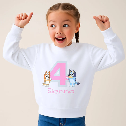 Girls Personalised Bluey and Bingo Birthday Sweatshirt: Child wearing a purple sweatshirt with bluey and bingo characters and her name underneath