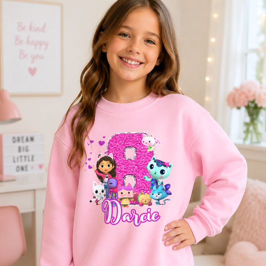 Personalised Gabby's Dollhouse Birthday Sweatshirt for Girls: A custom name and age sweatshirt for a girl's birthday Gabby's Dollhouse themed